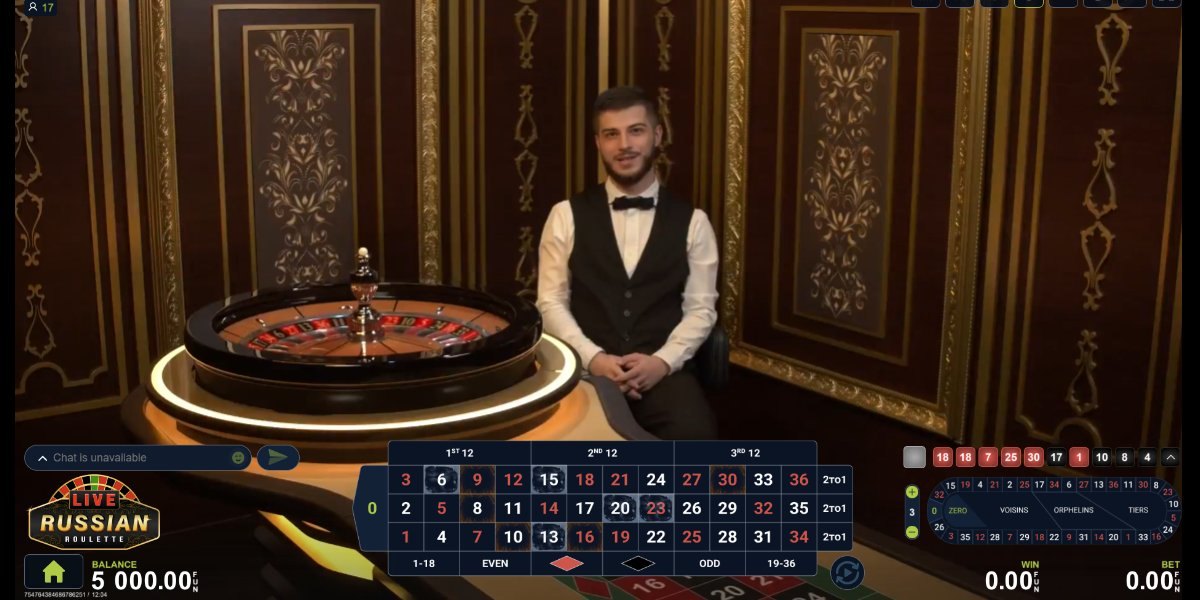 A croupier at a live dealer roulette table with the betting grid open